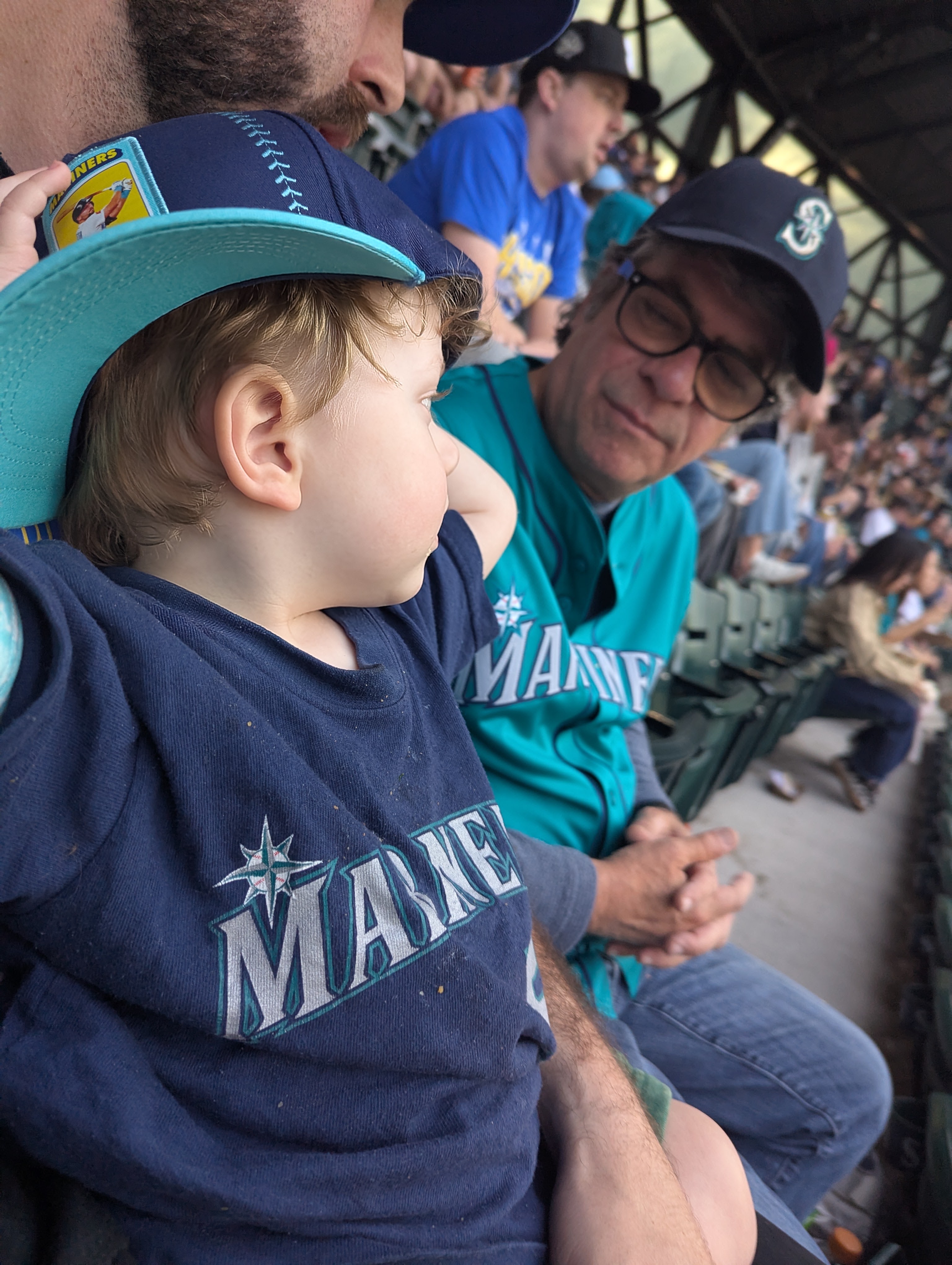 Mike watching a Seattle Mariners game with his first grandson, Levi, in 2026