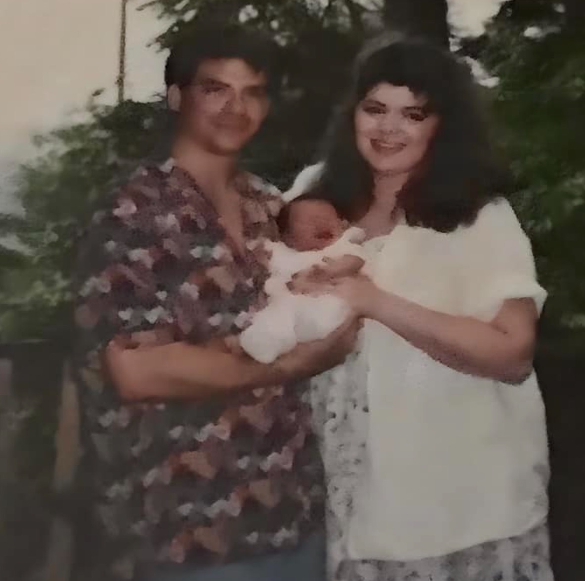 Mike with his wife, Rachael Sita, and newborn in 1993