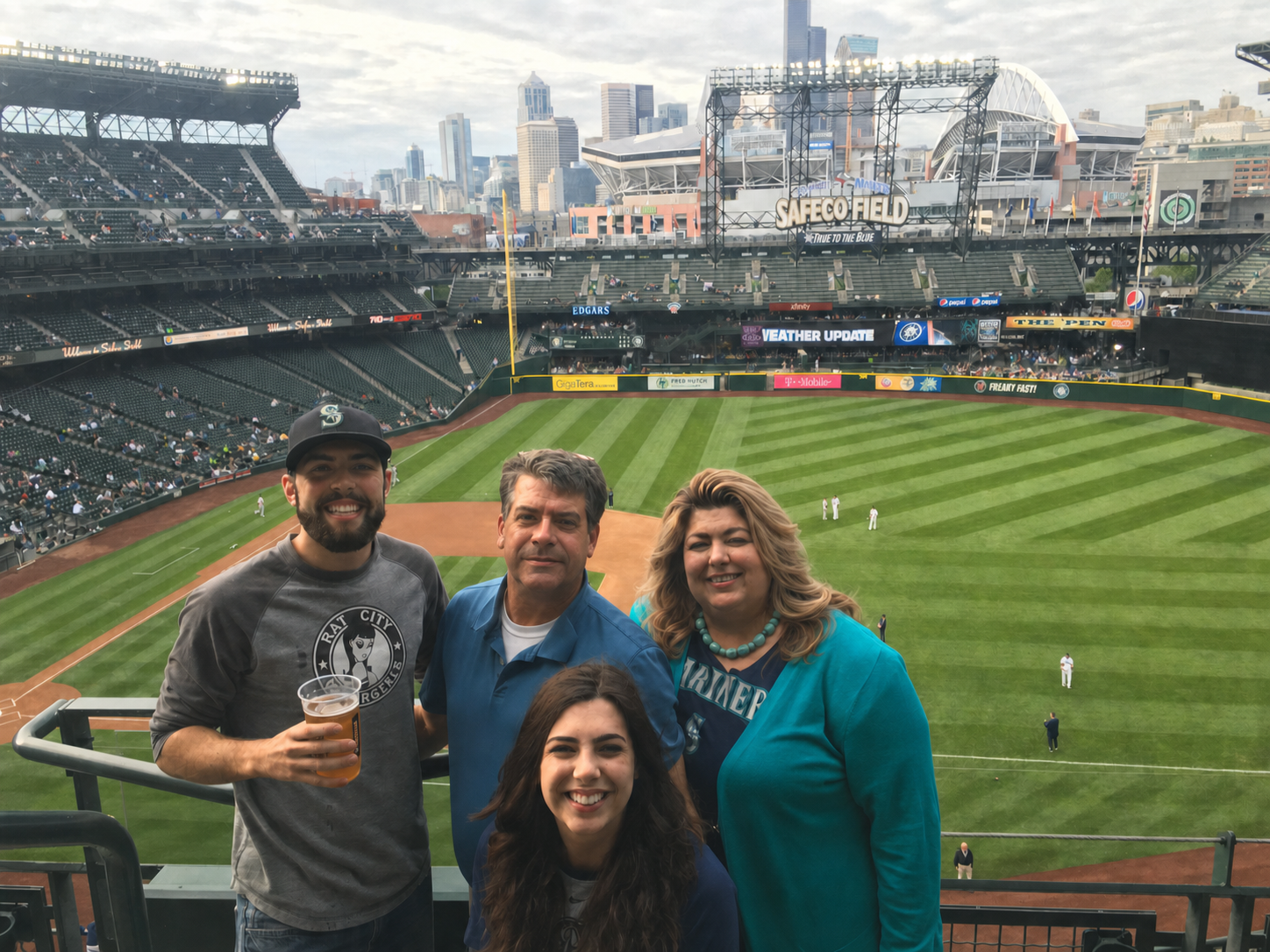 Mike and Rachael Sita with their two grown children at a Seattle Mariners game